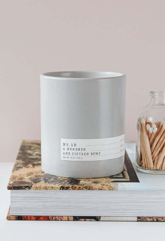 Gray candle in modern decor setting, perfect for enhancing your home with decor and wall art.